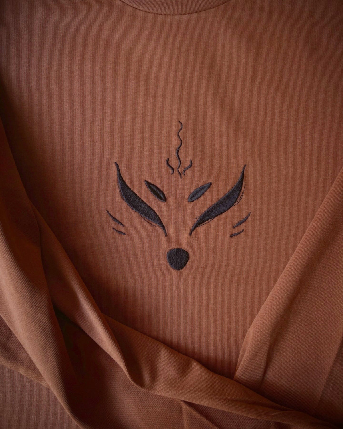 Embroidered Kitsune long-sleeve  close-up of front detailing