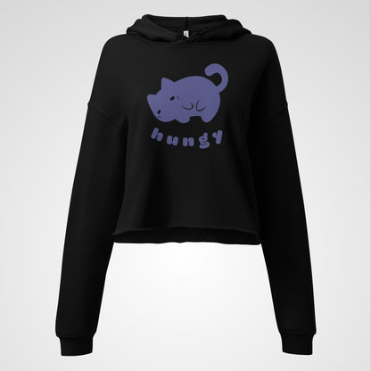 Front view of a black cropped hoodie with a cute round purple cat graphic and the bubble text 'hungy'
