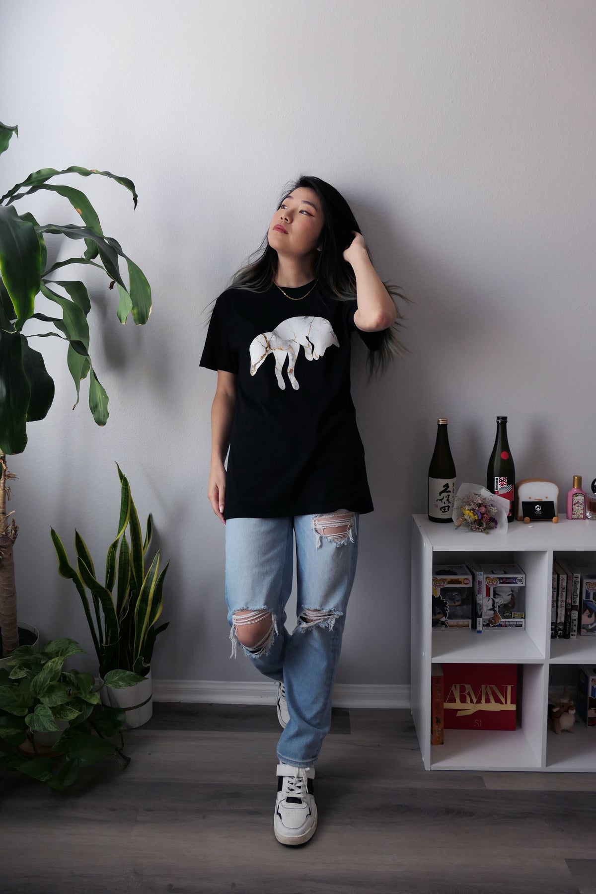 Marble Fox Premium Black T-shirt with distressed jeans and sneakers