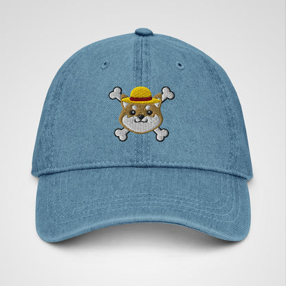 Blue denim hat featuring embroidered logo of a shiba inu x One Piece Luffy's hat and crossbones